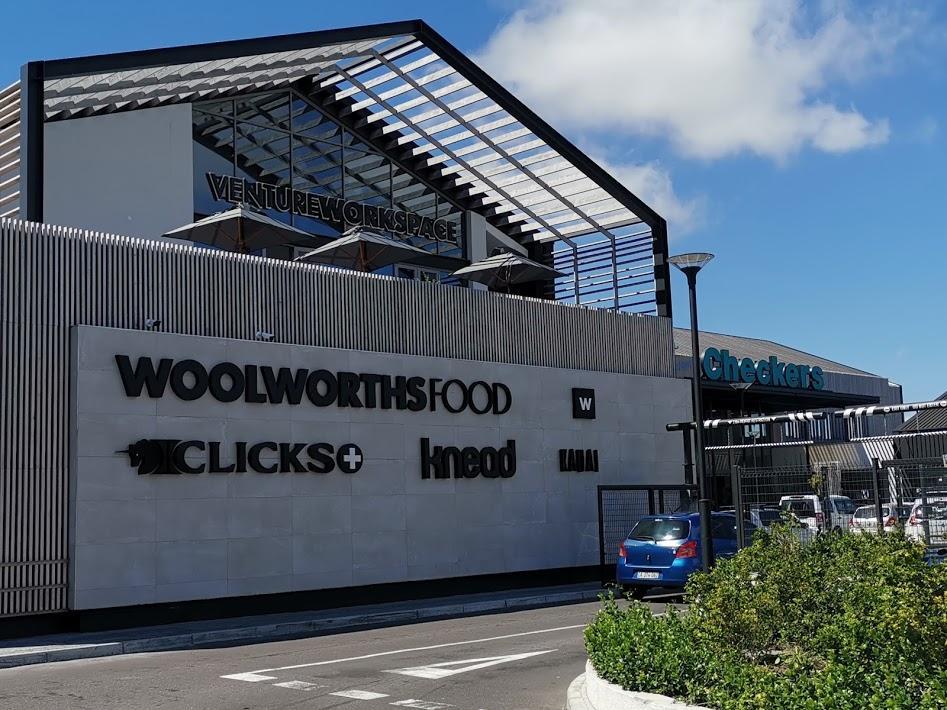 Front of Constantia Emporium with woolworths, clicks and other brands being showcased